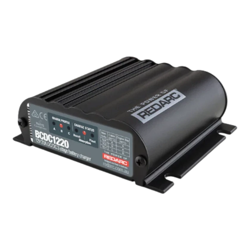 Redarc BCDC1220-IGN 12V 20A under-bonnet DC-DC battery charger — front view of grey potted body with input and output terminals
