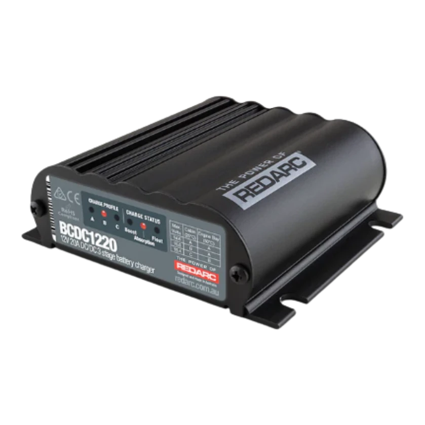 Redarc BCDC1220-IGN 12V 20A under-bonnet DC-DC battery charger — front view of grey potted body with input and output terminals