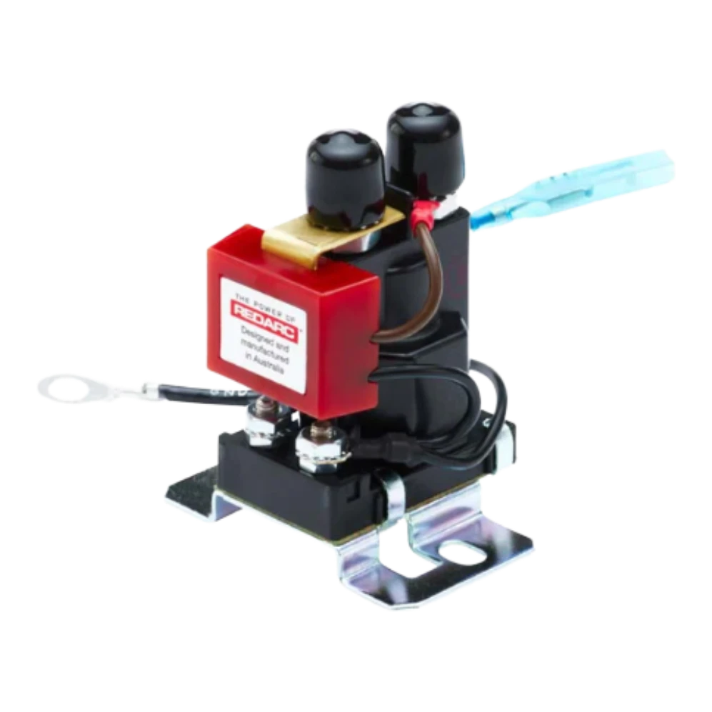 Redarc Smart Start SBI 100A battery isolator, the red Redarc housing mounted on a solenoid with two heavy studs on top, a zinc-plated mounting bracket underneath, and the earth lead and blue sense wire already fitted