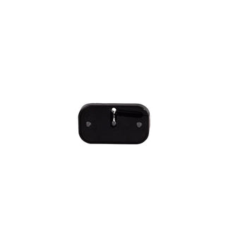 The same black rubber mounting pad from the top, the smooth face with a central slot and two locating dimples
