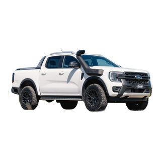 White Ford Ranger pickup truck on a road with a clear blue sky