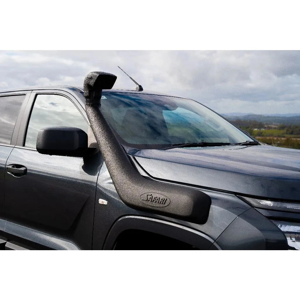 Car with a SAFARI V-SPEC SNORKEL against a cloudy sky