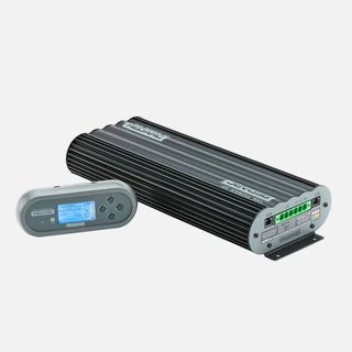 REDARC Manager30 BMS1230S3 and its battery monitor shown together at an angle, with the finned black alloy case and the connector end visible