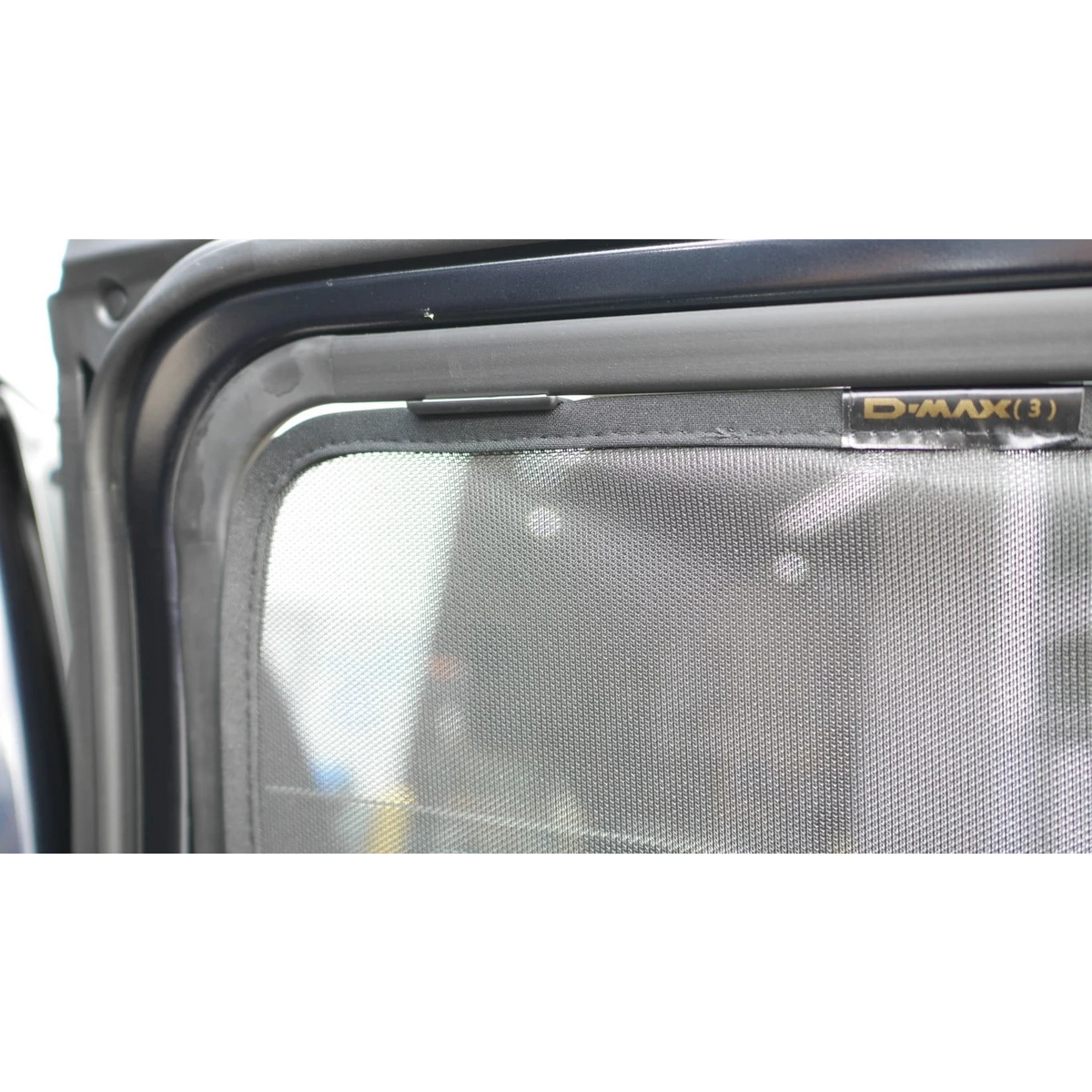 SnapShades Rear Window Shades Isuzu D-MAX RG – mesh shade fitted to the rear door window with D-MAX branding visible