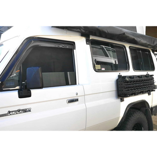 White Landcruiser Troopcarrier with roof rack and SnapShades on the side windows