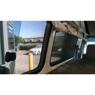 Interior view of a side window with SnapShade fitted – SnapShades Second Row Side Port Windows Suit 75/78 Troopcarrier