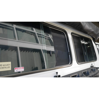 Close-up of a Troopcarrier side window with SnapShade fitted – SnapShades Side Port Windows Suit 75/78 Troopcarrier