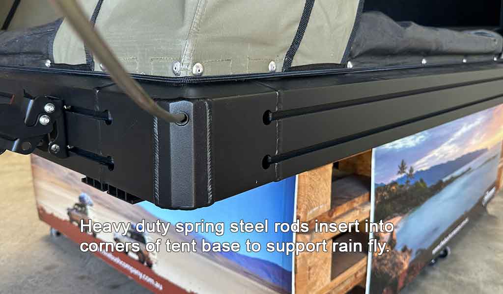 Heavy-duty spring steel rods supporting a rain fly on a tent base.