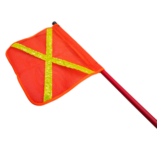 The orange mesh safety flag seen face on with the yellow reflective cross, clipped to the top of the red fibreglass whip