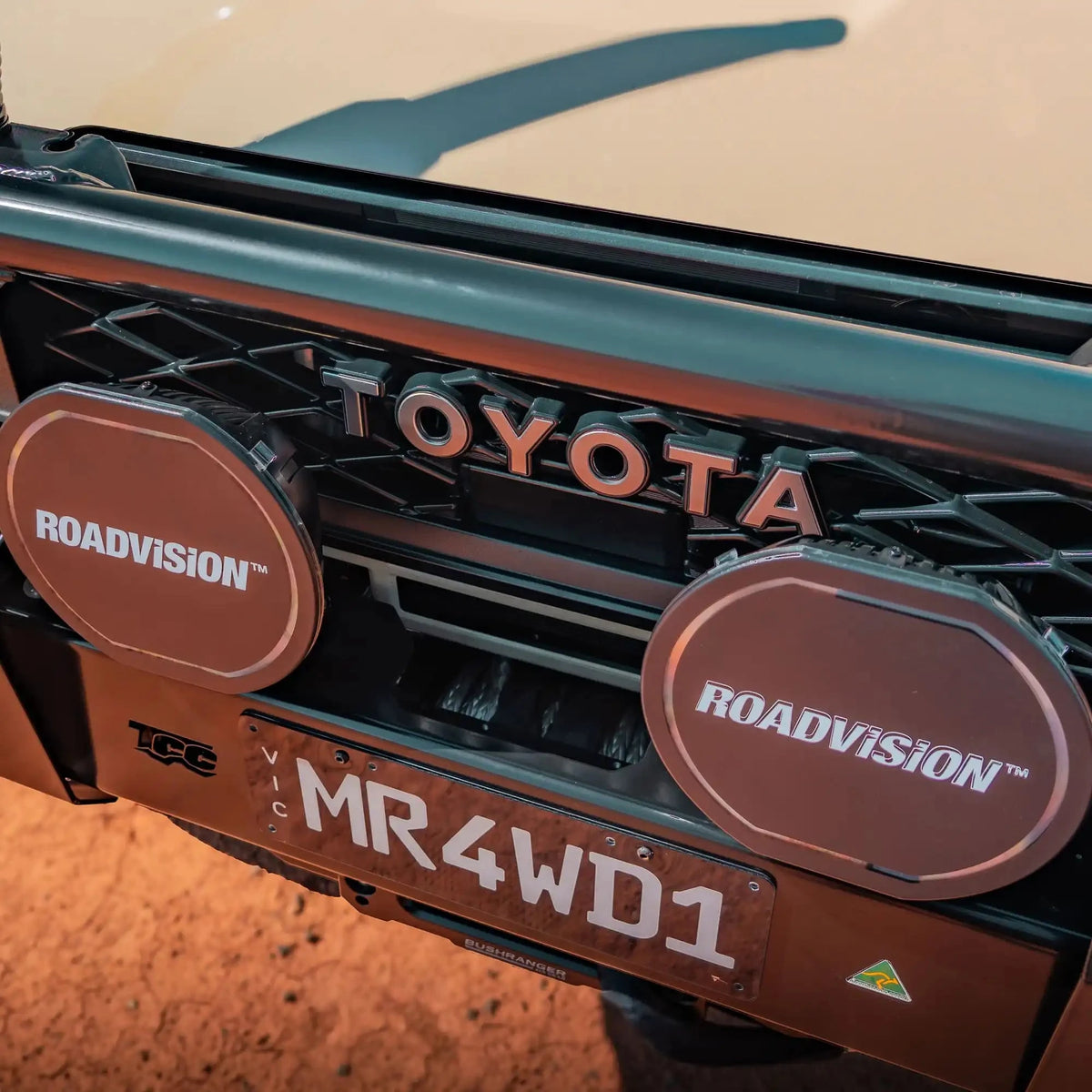 Close-up of a Toyota vehicle with Roadvision lights and a license plate – TCC 70 Series Bull Bar - Facelift (2024 - Present)