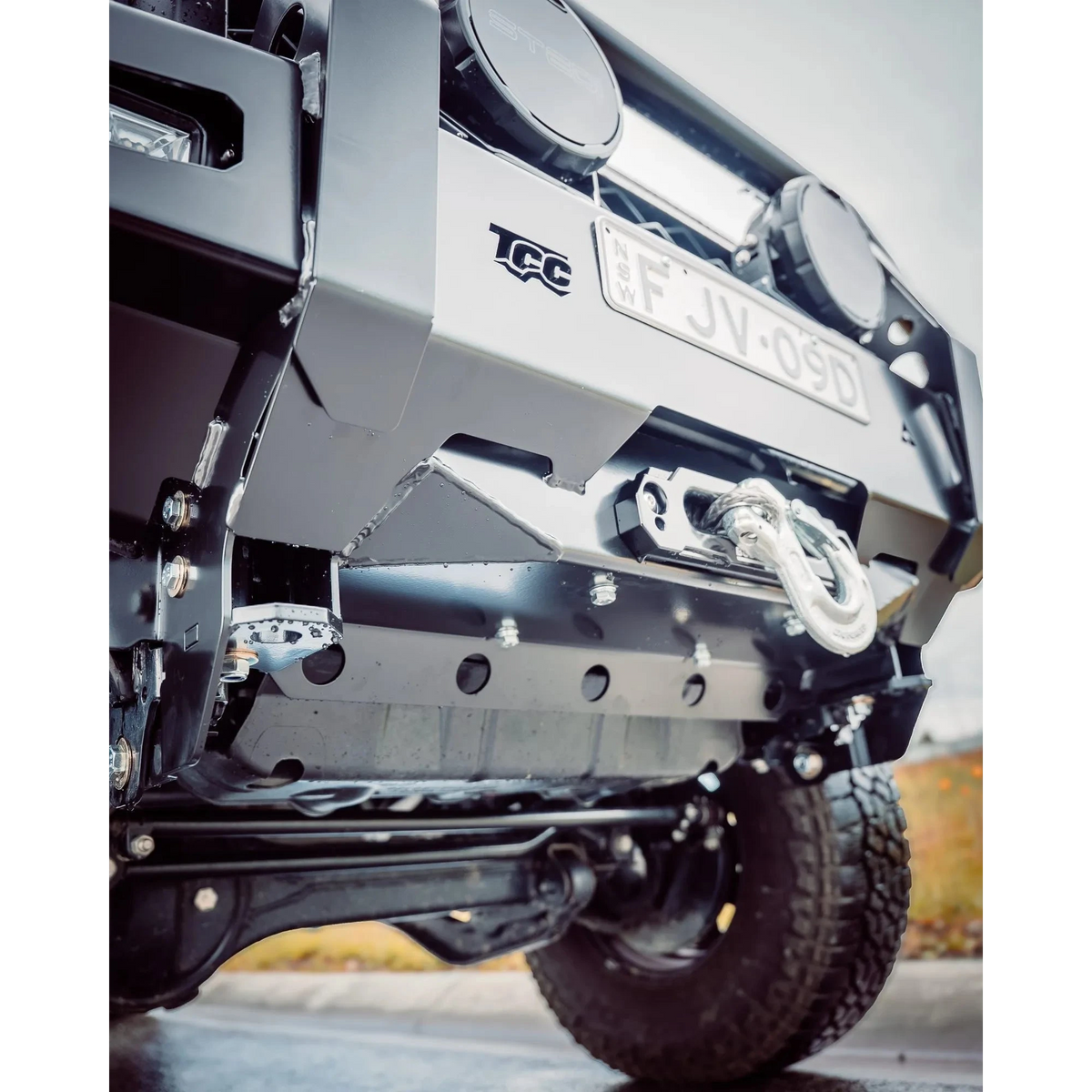 Close-up of a vehicle's front bumper with TCC branding and license plate – TCC 70 Series Single Cab Bull Bar - Facelift (2024 - Present)
