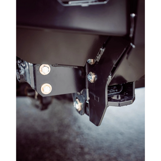 Close-up of a metal bracket with screws on a dark background – TCC 70 Series Single Cab Bull Bar - Facelift (2024 - Present)