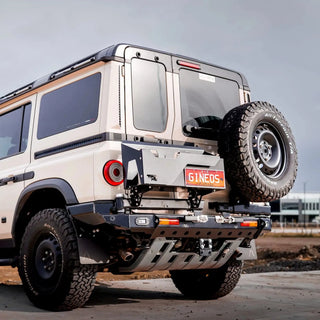 TCC INEOS Grenadier Rear Bar – beige Grenadier on large tyres on a clear day