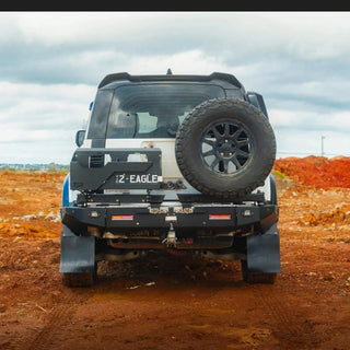 TCC Land Rover Defender 2020+ Rear Bar fitted, rear view on a dirt road