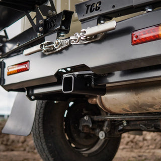 Close-up of a vehicle's hitch and trailer attachment system with 'TCC' branding – TCC Suzuki Jimny (JB74) Rear Bar