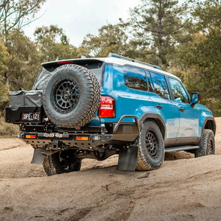Blue SUV with spare tire on a dirt road surrounded by trees – TCC Toyota Prado 250 Series Rear Bar
