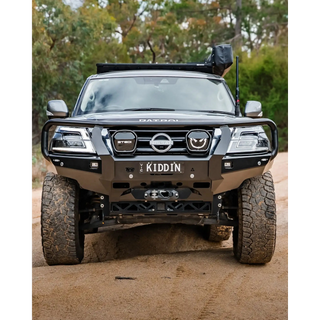 Black Nissan Patrol SUV on a dirt road – TCC Y62 Patrol S5 Bull Bar