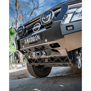 Close-up of a Nissan Patrol front bumper in an outdoor setting – TCC Y62 Patrol S5 Bull Bar