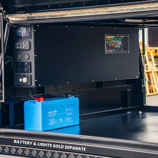 The Prospector installed in a canopy with the Victron display and switch panel at the left, the EGON DC Hub window at the right, and an Amptron lithium battery below
