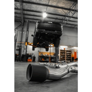 Car exhaust system on a concrete floor in a workshop – Torqit 3″ CAT Back Performance EXHAUST Toyota Tundra 3.5L V6 Petrol