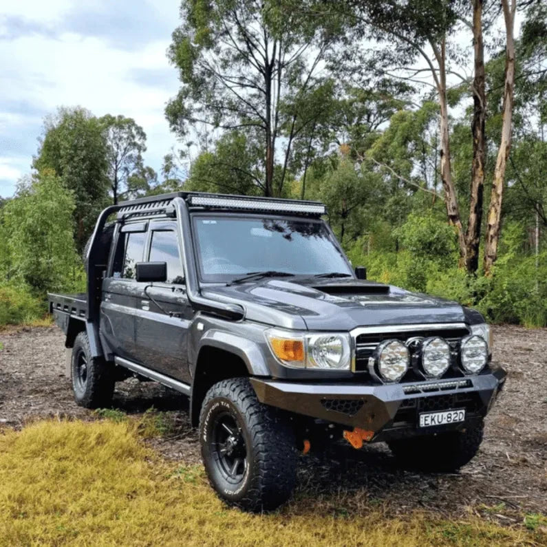 79 Series Landcruiser with snorkel in a forested area – Torqit 4" Stainless Steel Snorkel (Matte Black) for Toyota 79 Series Landcruiser