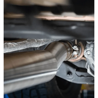Close-up of a car exhaust system with a focus on the pipe and mounting hardware – Torqit Single Exit 3″ Cat Back Performance Exhaust for Jeep Gladiator 2020+