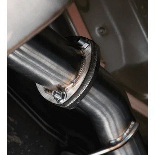 Close-up of a metal exhaust pipe with a bolt, likely from a vehicle – Torqit Single Exit 3″ Cat Back Performance Exhaust for Jeep Gladiator 2020+