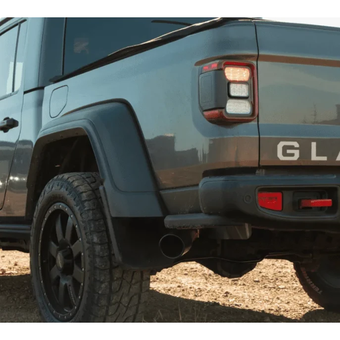 Close-up of a blue Jeep Gladiator in an outdoor setting