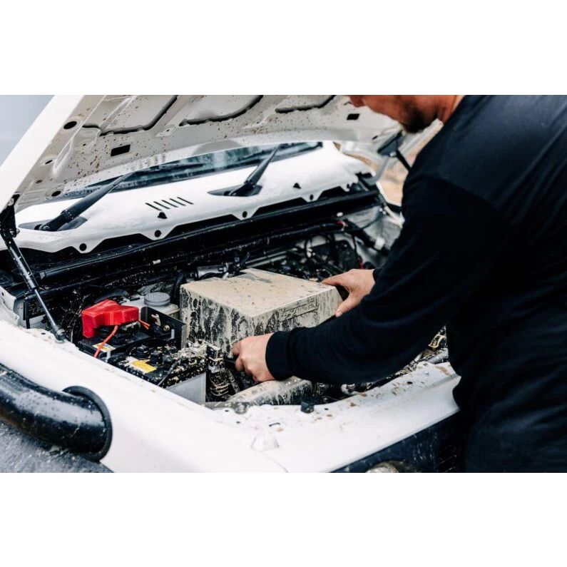 Installer fitting the airbox in the engine bay – Torqit Stainless Steel Airbox (Matte Black) for Suzuki Jimny (JB74 / JC74)