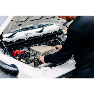 Installer fitting the airbox in the engine bay – Torqit Stainless Steel Airbox (Matte Black) for Suzuki Jimny (JB74 / JC74)