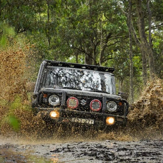 Suzuki Jimny driving through a muddy forest track – Torqit Stainless Steel Airbox (Matte Black) for Suzuki Jimny (JB74 / JC74)