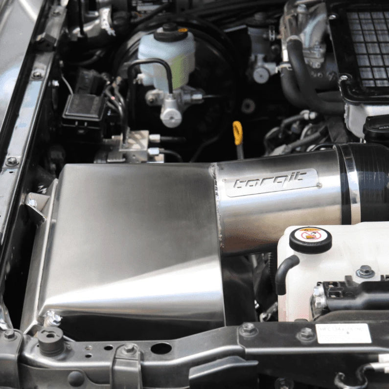Close-up of a Torqit airbox fitted in the engine bay – Torqit Stainless Steel Airbox (Matte Black) for Toyota 4.5L 79 Series Landcruiser