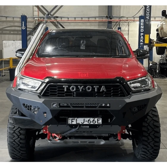Red Toyota Hilux with snorkel fitted in a workshop – Torqit Stainless Steel Snorkel (Matte Black) for Toyota Hilux N80 2.8L