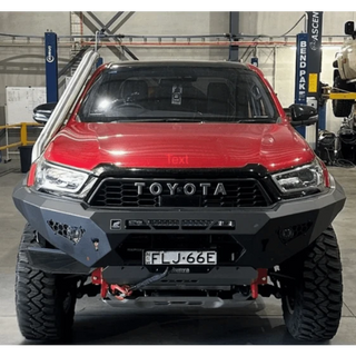 Red Toyota Hilux with snorkel fitted in a workshop – Torqit Stainless Steel Snorkel (Matte Black) for Toyota Hilux N80 2.8L
