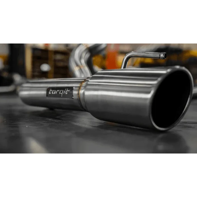 Stainless steel exhaust pipe with 'torqit' branding on a blurred background