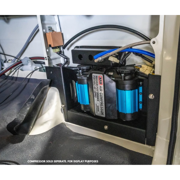 Close-up of ARB compressor and aluminium bracket inside the rear quarter panel