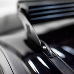 Close-up of a car's grille with a blurred background