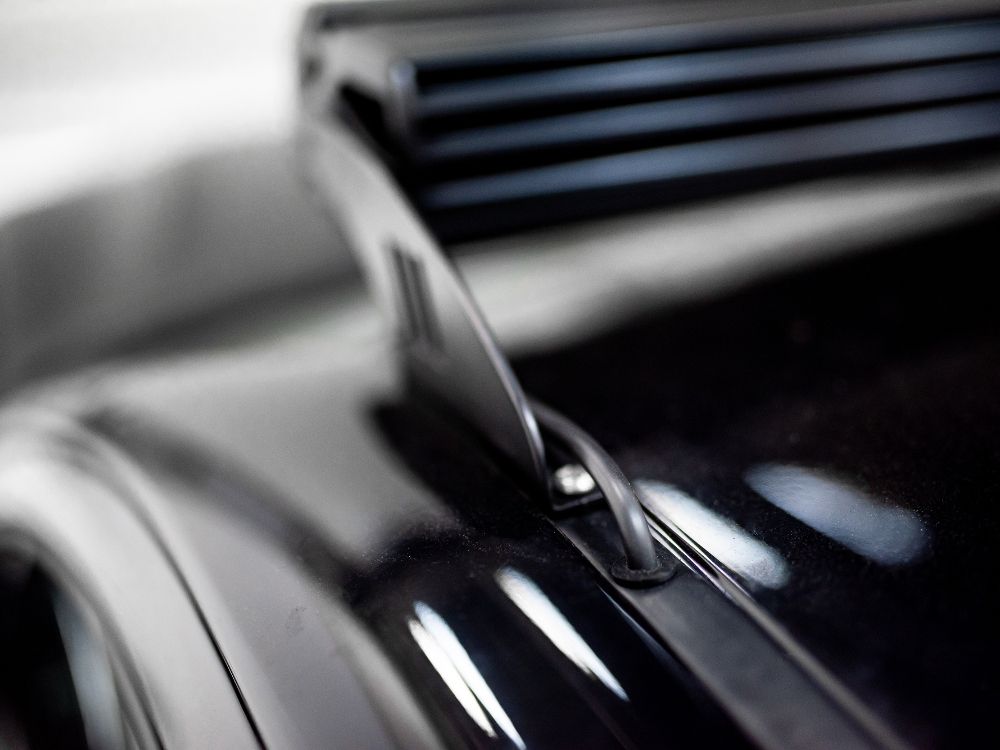Close-up of a car's grille with a blurred background