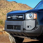 Close-up of a blue Toyota vehicle in a desert setting