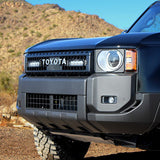 Close-up of a blue Toyota vehicle in a desert setting