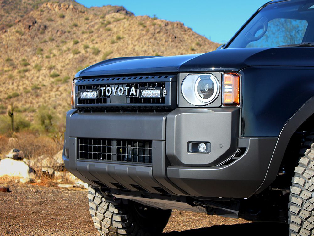 Close-up of a blue Toyota vehicle in a desert setting