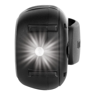 The torch end of a Uniden UH620 handheld UHF radio, the white LED lit in the moulded housing with the belt clip visible behind