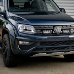 Front view of a black Volkswagen SUV parked on a concrete surface.