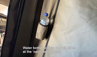 Water bottle holder on a tent with text indicating it's at the 'open' end of the tent.