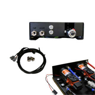 The EGON Water Hub with its electrical kit, showing the outlet end of the hub, the wiring loom with two illuminated push switches, and the inside of the hub with the twin pumps and blue plumbing lines